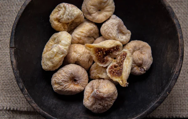 dry figs in rustic wooden bowl dry fruits