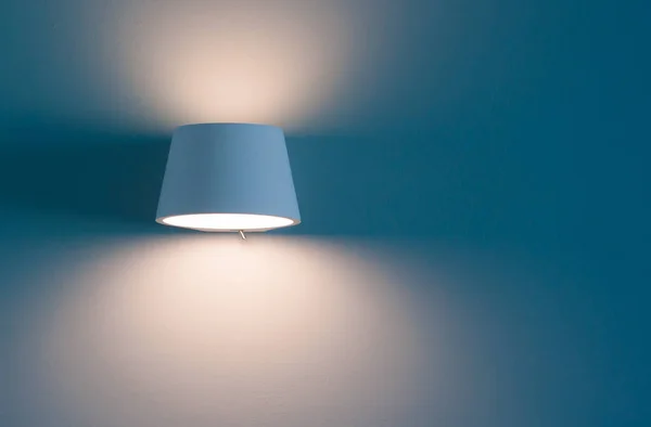 The orange  Light Beam from lamp on blue wallpaper background — Stock Photo, Image