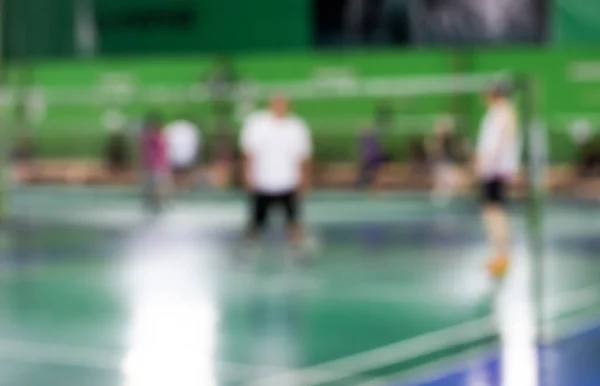 Borrosa de cancha de bádminton con jugadores jugando bádminton —  Fotos de Stock