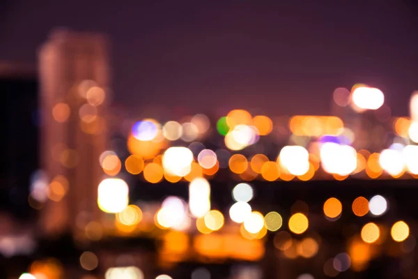 O bokeh Cityscape, foto borrada, paisagem urbana no crepúsculo tempo Fotografia De Stock