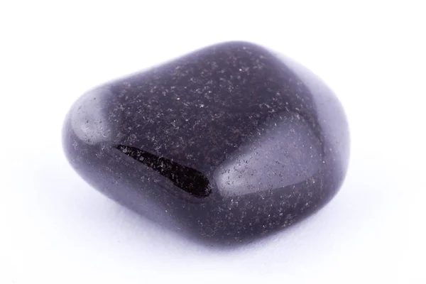 Macro mineral stone black onyx against white background