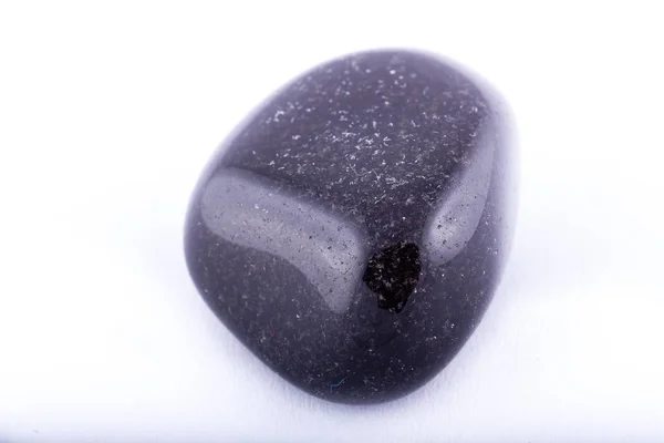 Macro mineral stone black onyx against white background — Stock Photo, Image