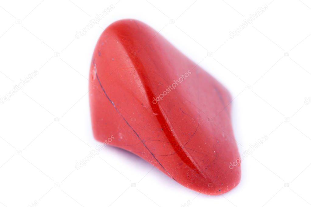 macro red jasper stone, close-up on a white background