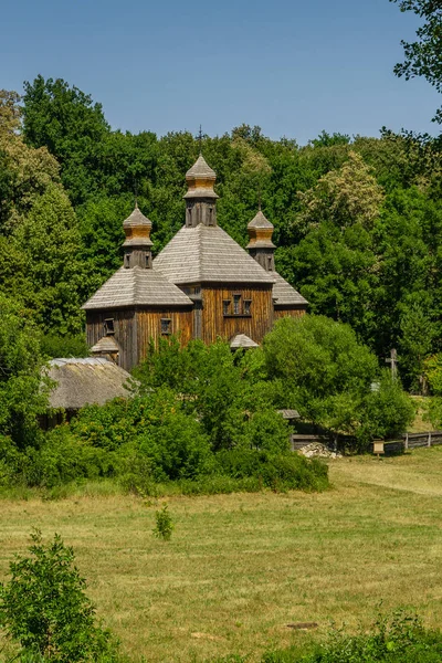 Old wooden church on a background of blue sky — Stock Photo, Image