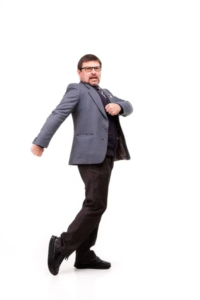 Handsome man in suit and glasses, dancing, white background — Stock Photo, Image