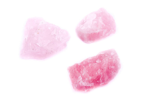 Macro mineral stone Pink quartz on a white background