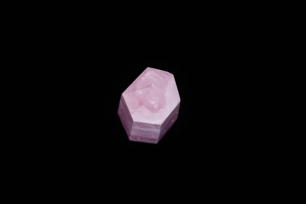 Macro mineral pink quartz crystal on a black background — Stock Photo, Image