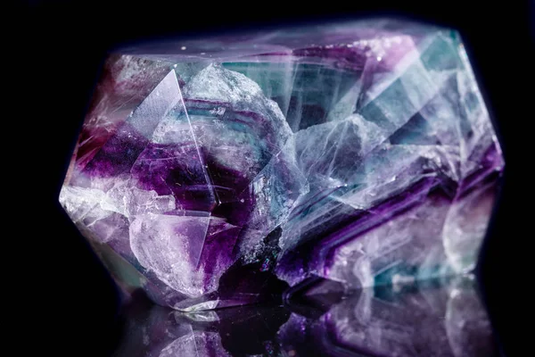 Macro mineral stone Fluorite crystal on a black background — Stock Photo, Image