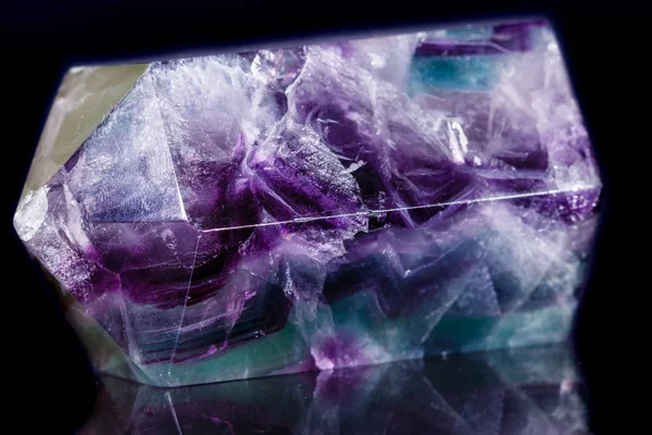 Macro mineral stone Fluorite crystal on a black background — Stock Photo, Image