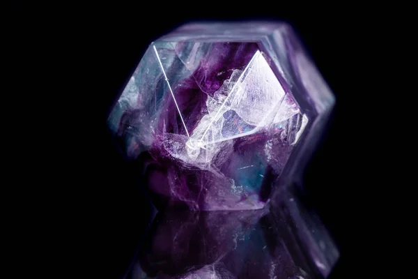 Macro mineral stone Fluorite crystal on a black background — Stock Photo, Image