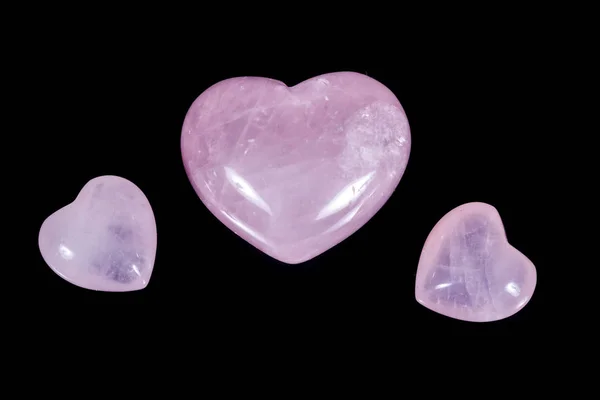 Macro mineral stone Heart pink quartz on a black background — Stock Photo, Image