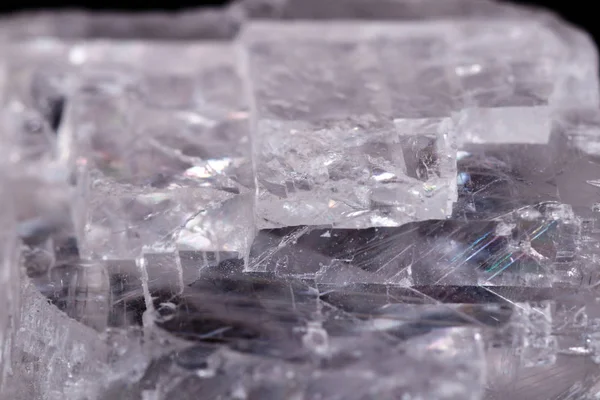 Macro mineral stone Iceland spar on black background — Stock Photo, Image