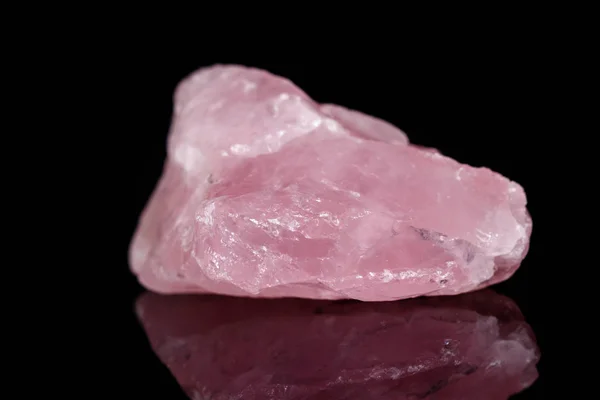 Macro mineral stone Pink quartz on black background — Stock Photo, Image