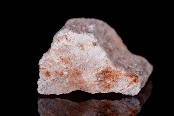 Macro mineral stone red gypsum on black background