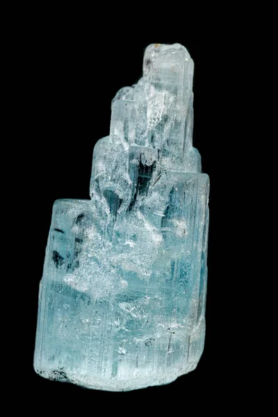 macro mineral aquamarine stone on a black background