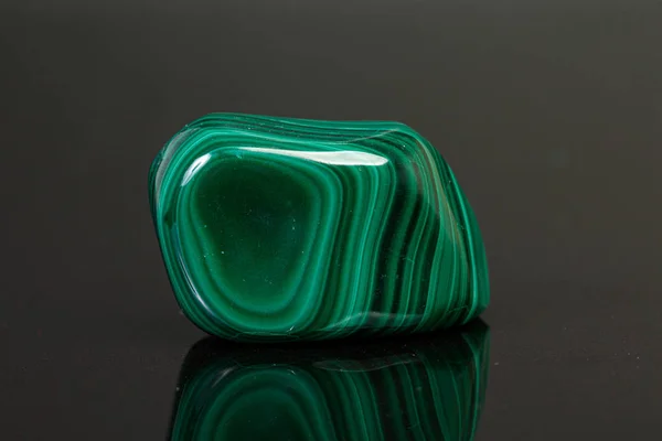 Macro mineral stone malachite on a black background — Stock Photo, Image