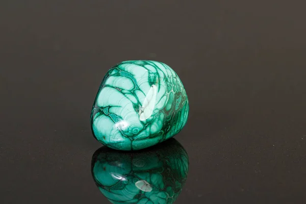 Macro mineral stone malachite on a black background — Stock Photo, Image