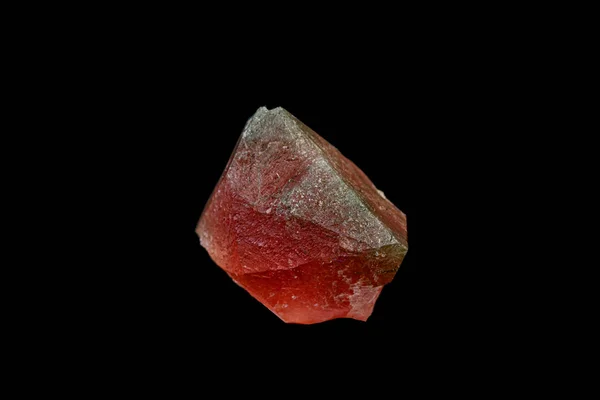 Macro mineral stone pink fluorite on a black background — ストック写真