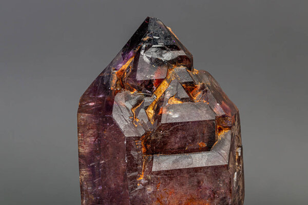 macro mineral stone  amethyst with smoky quartz on a black backg