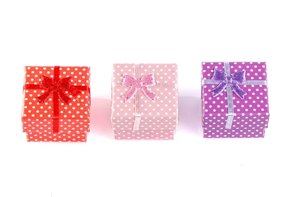 Beautiful new year red gift boxes on white background — Stock Photo, Image