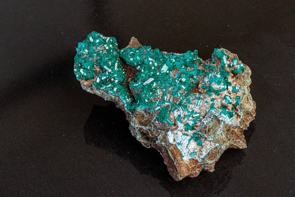 Macro mineral stone Dioptase on a gray background — Stock Photo, Image