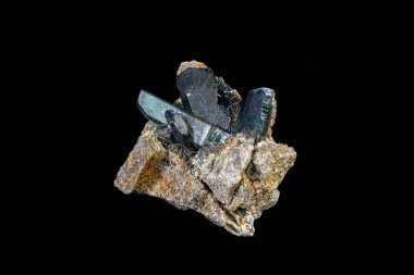 Macro mineral stone Vivianite on a gray background clipart
