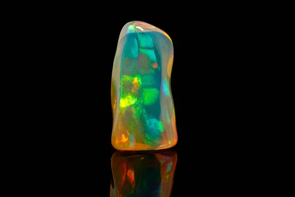 Macro mineral stone rare and beautiful opals on a black backgrou — Stock Photo, Image