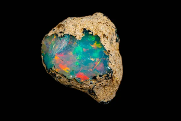 Macro mineral stone rare and beautiful opals on a black backgrou — 스톡 사진