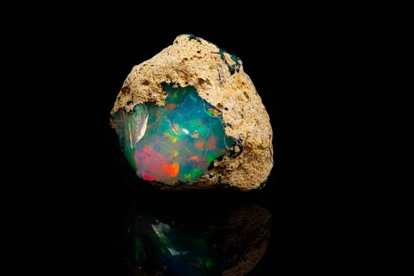 Macro mineral stone rare and beautiful opals on a black backgrou — 스톡 사진