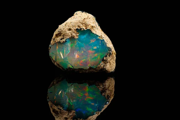 Macro mineral stone rare and beautiful opals on a black backgrou — Stock Photo, Image