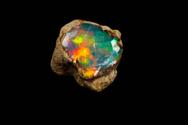 Macro mineral stone rare and beautiful opals on a black backgrou — Stock Photo, Image