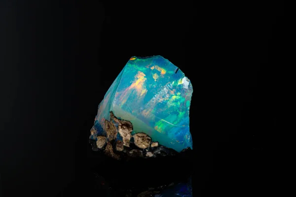 Macro mineral stone rare and beautiful opals on a black backgrou — Stock Photo, Image