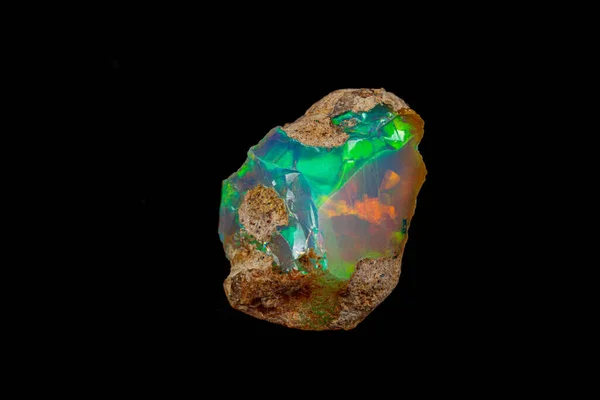 Macro mineral stone rare and beautiful opals on a black backgrou — 스톡 사진