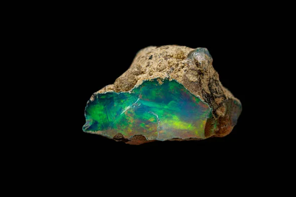 Macro mineral stone rare and beautiful opals on a black backgrou — Stock Photo, Image