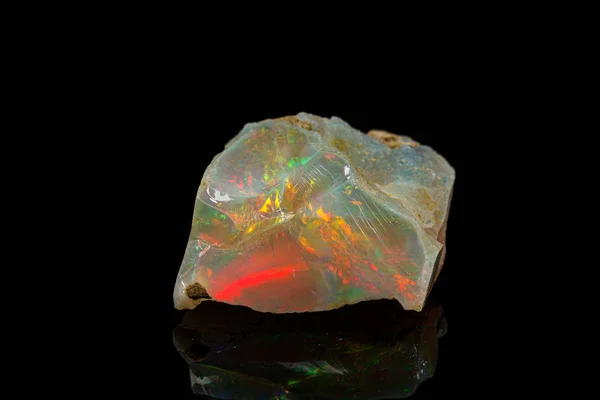 Macro mineral stone rare and beautiful opals on a black backgrou — 스톡 사진