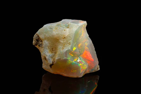 Macro mineral stone rare and beautiful opals on a black backgrou — Stock Photo, Image