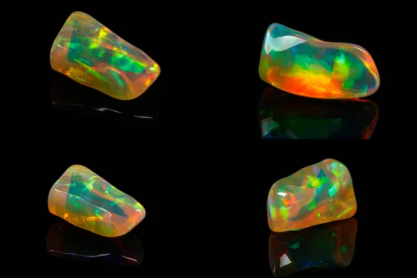 Pedra mineral macro raras e belas opalas em um backgrou preto — Fotografia de Stock