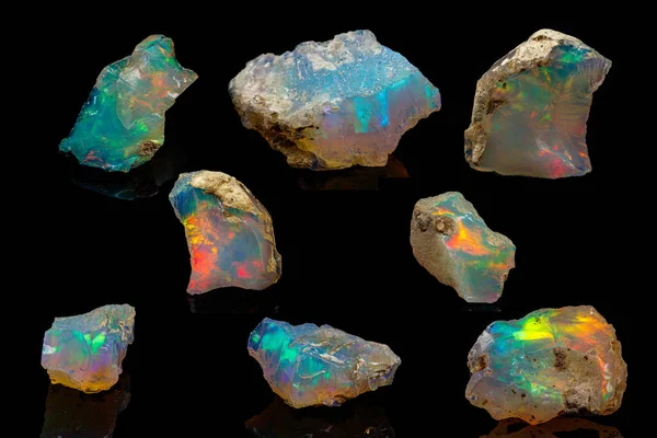 Macro mineral stone rare and beautiful opals on a black backgrou — 스톡 사진