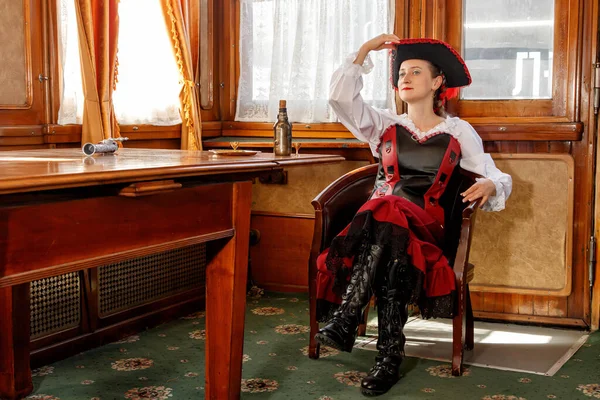 beautiful girl in steampunk costume in an old train carriage close-up