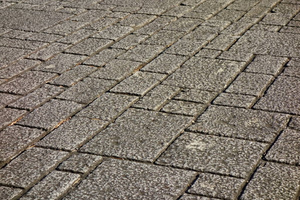Large sidewalk plaza with cobblestone paving stones
