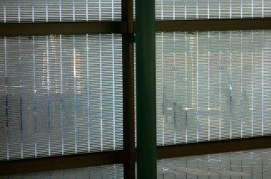 Pattern shadow picture of people reflected in the glass of the window frame in front of the station                               