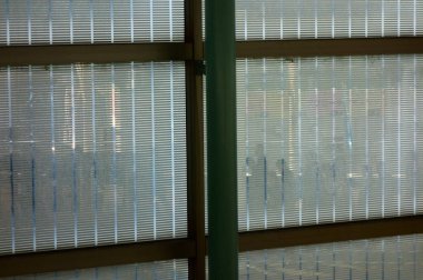 Pattern shadow picture of people reflected in the glass of the window frame in front of the station                               