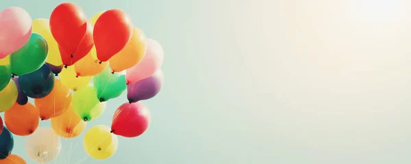 colorful balloon with blue sky and sunshine background