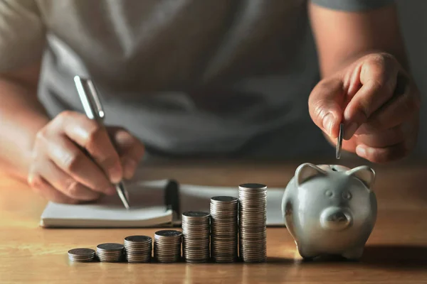 Saving money with hand putting coins in piggy bank concept finan — Φωτογραφία Αρχείου