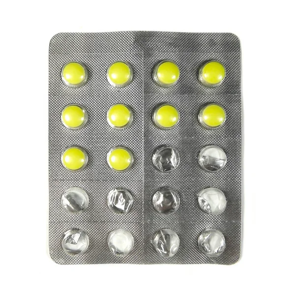 Half used pack of yellow pills isolated on white background. — Stock Photo, Image