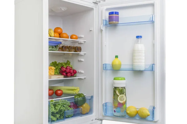 Open fridge full of fresh fruits and vegetables