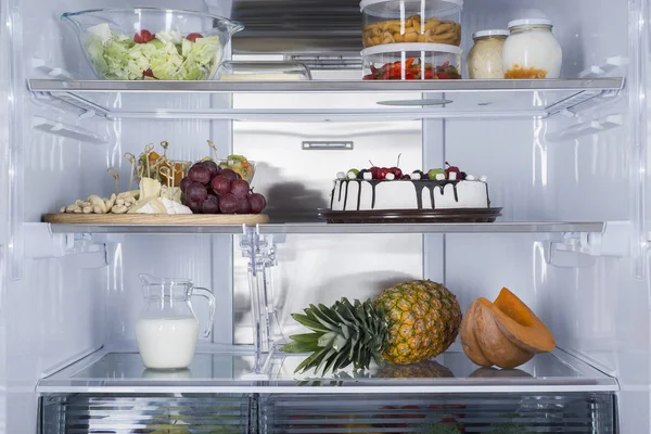 Open fridge full of fresh fruits and vegetables — Stock Photo, Image