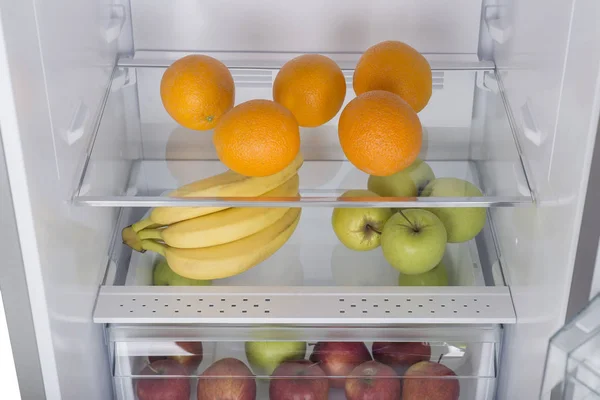 Open fridge full of fresh fruits and vegetables — Stock Photo, Image