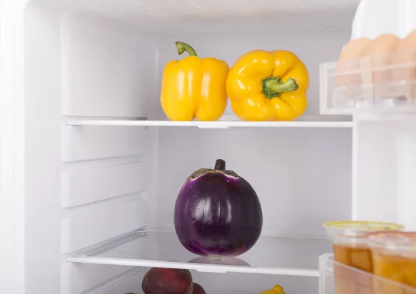 Open fridge full of fresh fruits and vegetables, healthy food background, organic nutrition, health care, dieting concept