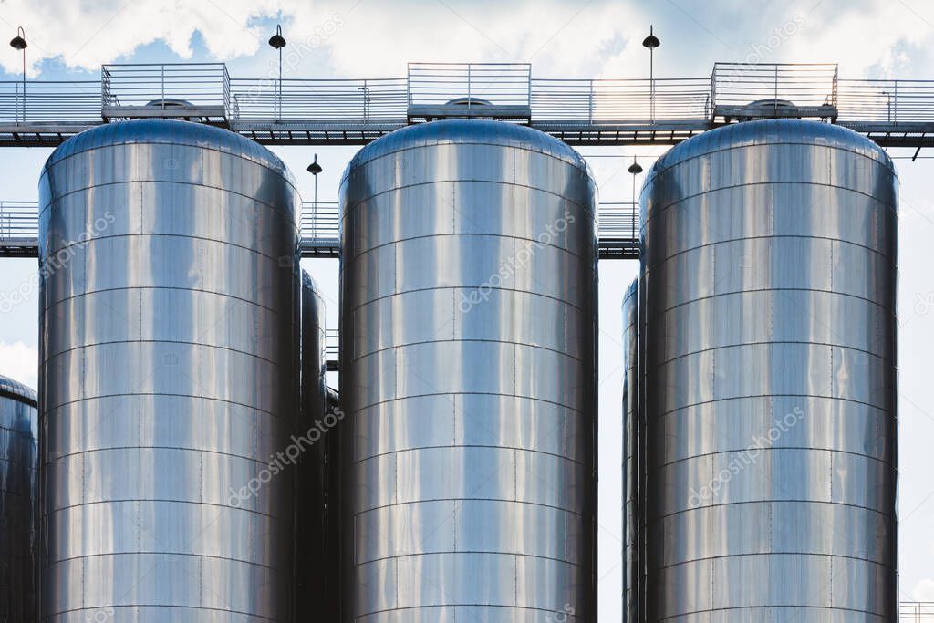 Beer production industry plant. Large amount of fermentation tanks.